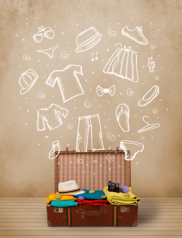 Traveler luggage with hand drawn clothes and icons on grungy background