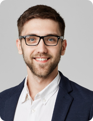 headshot of a man in a shirt and blazer