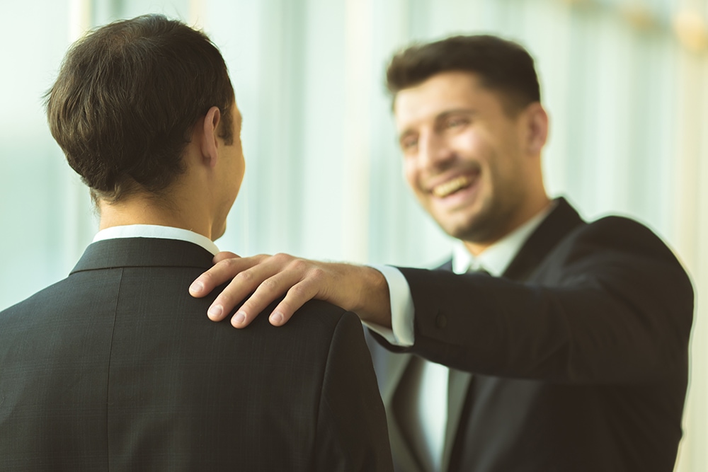 Two people talking in a friendly manner