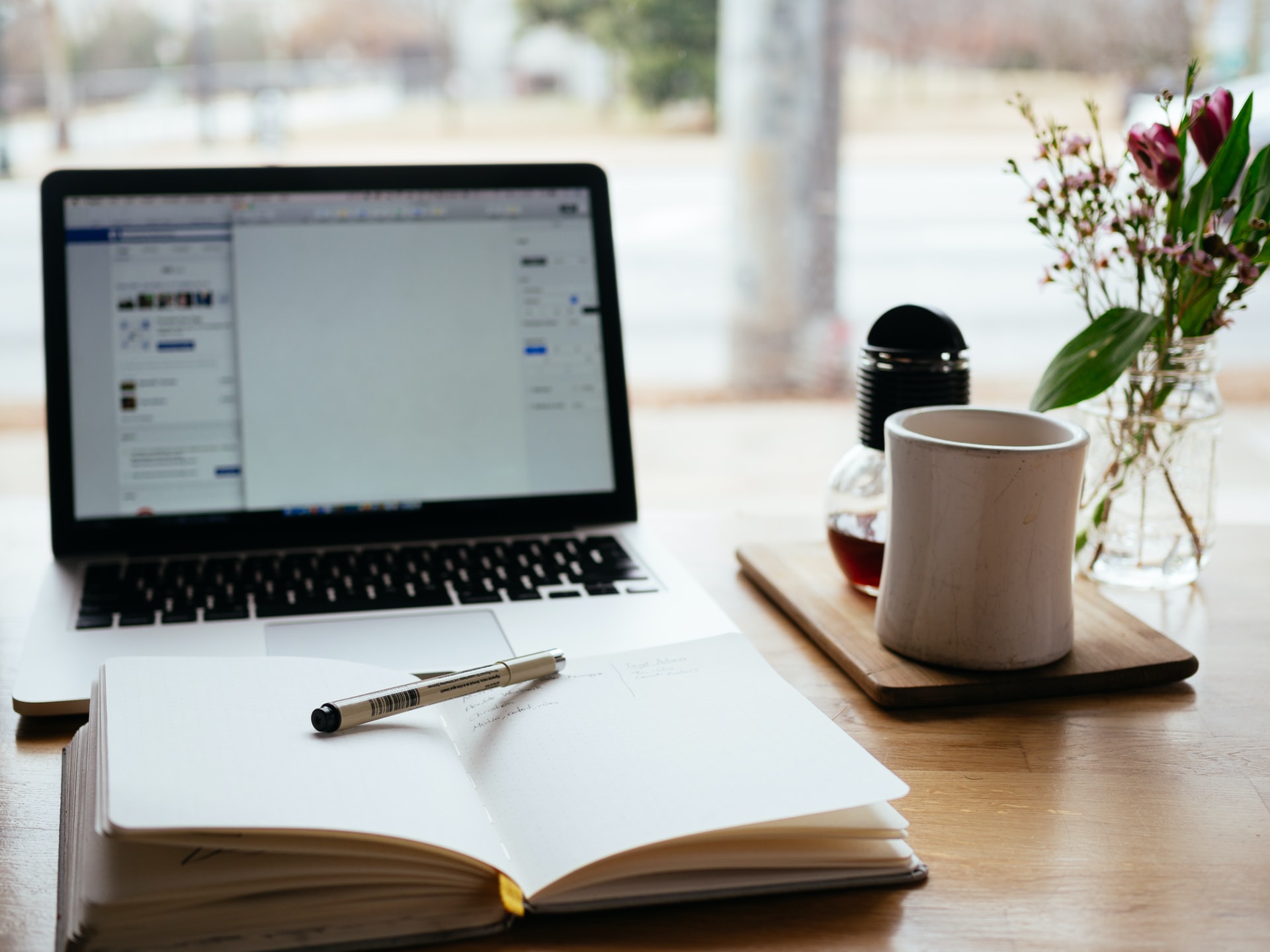 Purbeck Loan Notes Introduction Laptop With Open Book On Desk